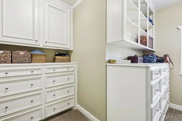 a view of cabinets and white cabinets