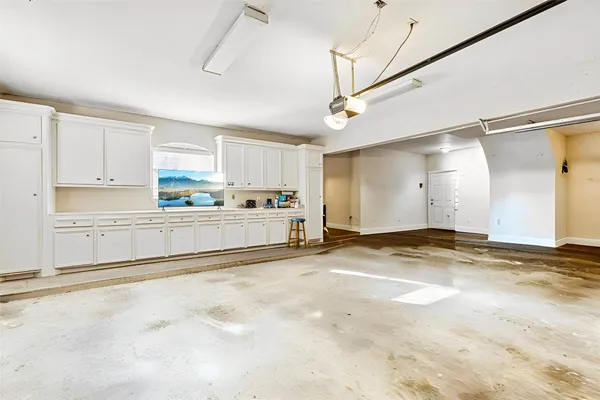 a view of a kitchen with a sink and cabinets