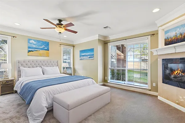 a bedroom with a large bed and a window