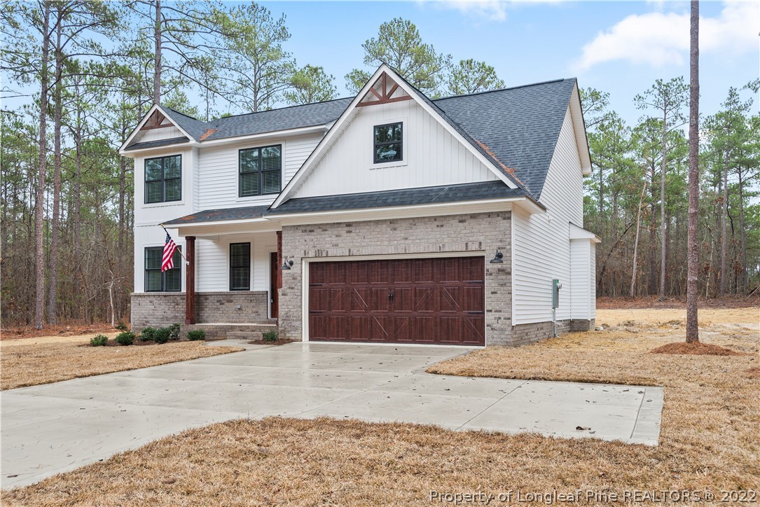 15581 Raccoon Run Road Wagram, NC 28396 - Photo 3 of 30 a front view of a house with a yard