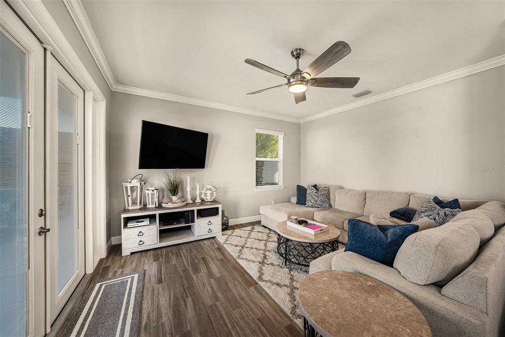 6412 Key Island Boulevard Apollo Beach, FL 33572 - Photo 13 of 42 a living room with furniture and a flat screen tv
