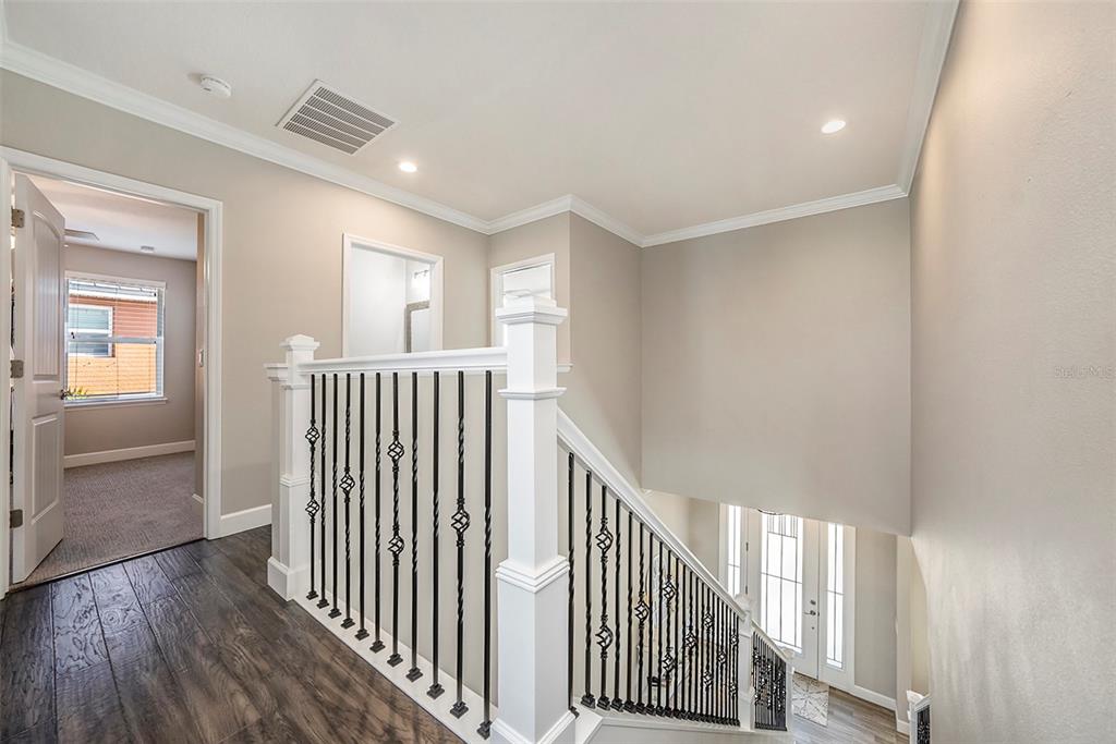 6412 Key Island Boulevard Apollo Beach, FL 33572 - Photo 27 of 42 a view of a hallway with wooden floor and windows