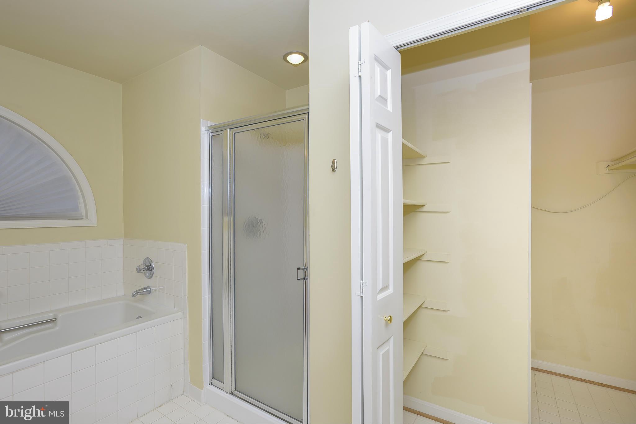 14243 Greenview Drive Laurel, MD 20708 - Photo 14 of 26 a bathroom with a bathtub and a shower