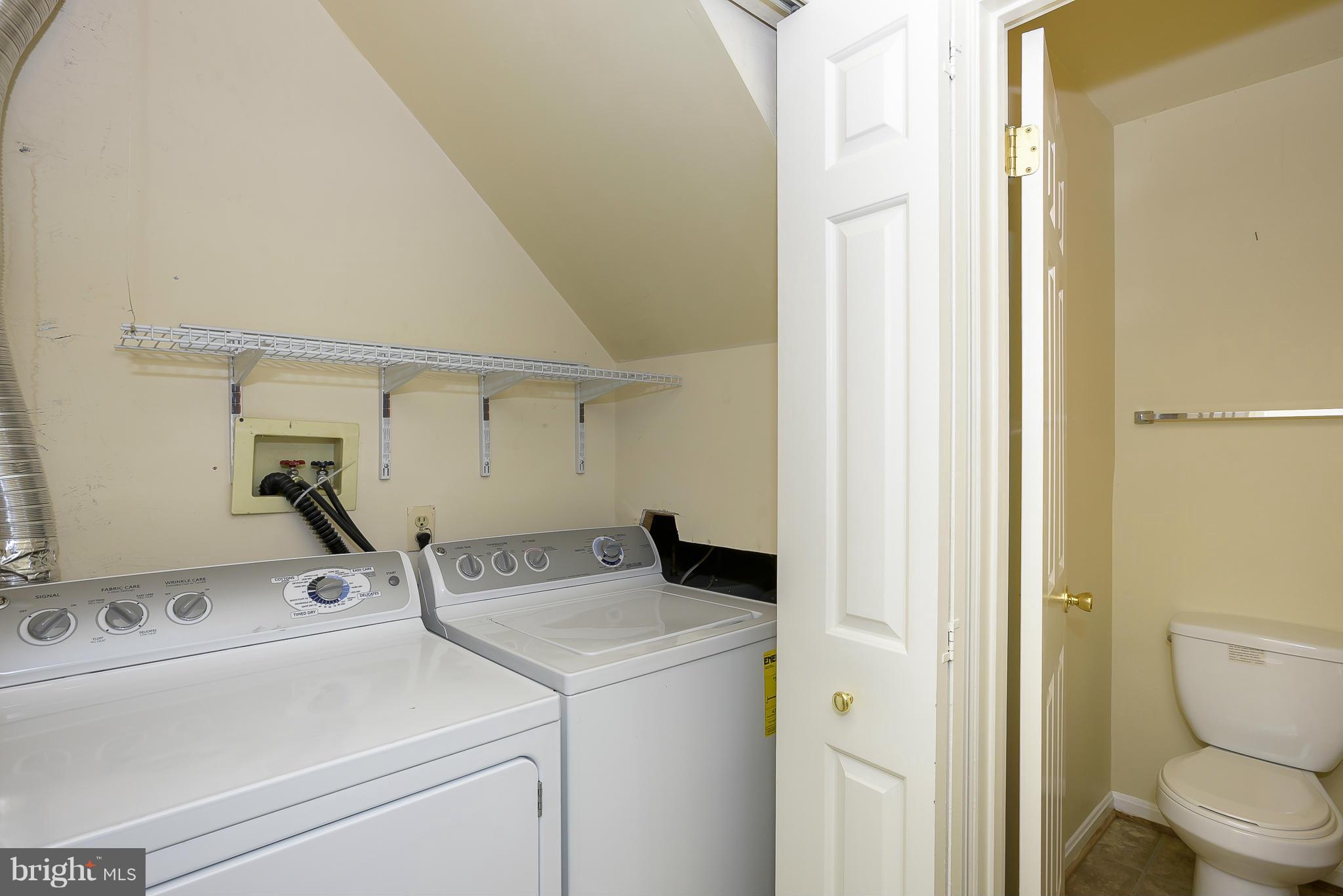14243 Greenview Drive Laurel, MD 20708 - Photo 15 of 26 a view of storage and utility room with washer and dryer