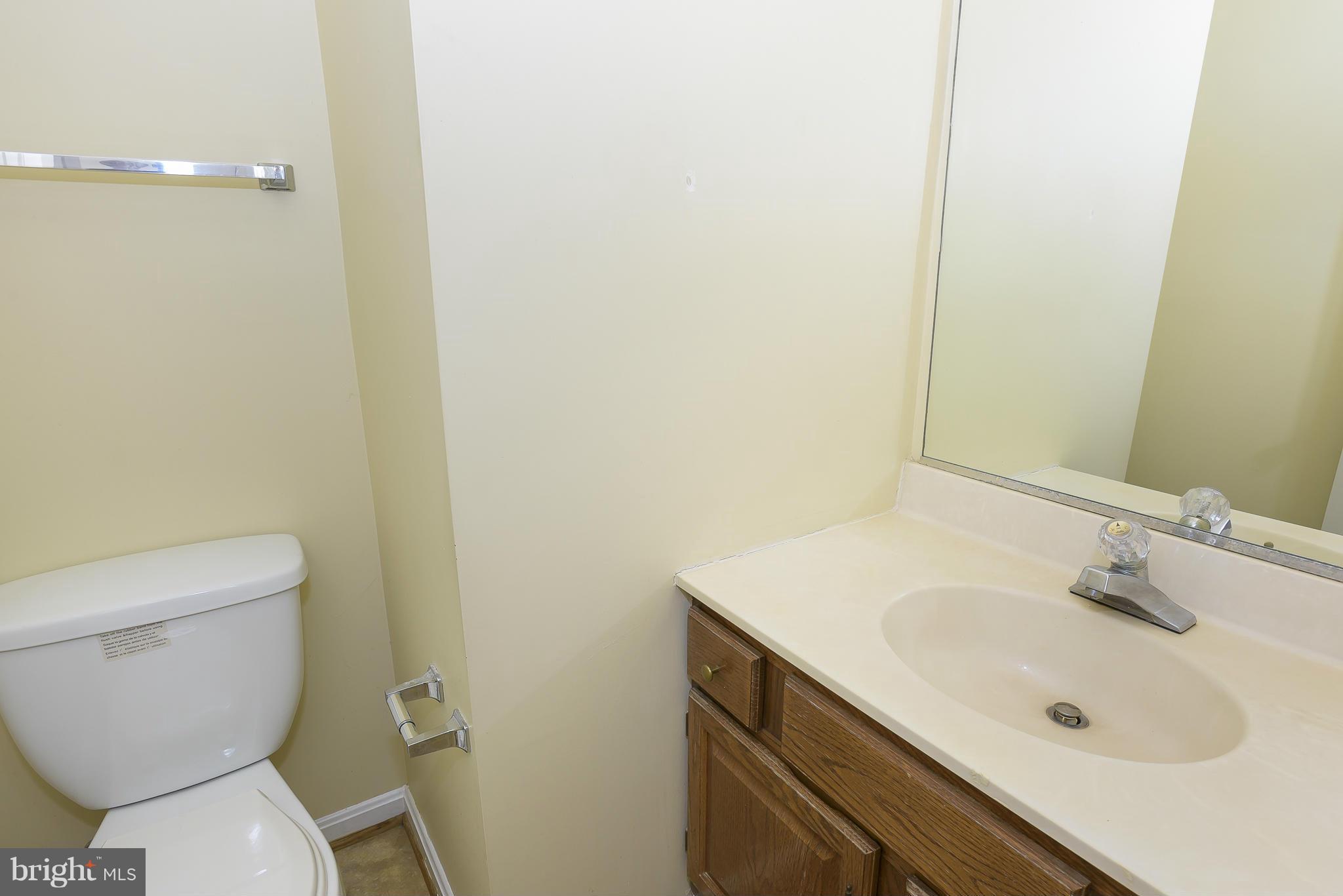 14243 Greenview Drive Laurel, MD 20708 - Photo 16 of 26 a bathroom with a sink and a toilet