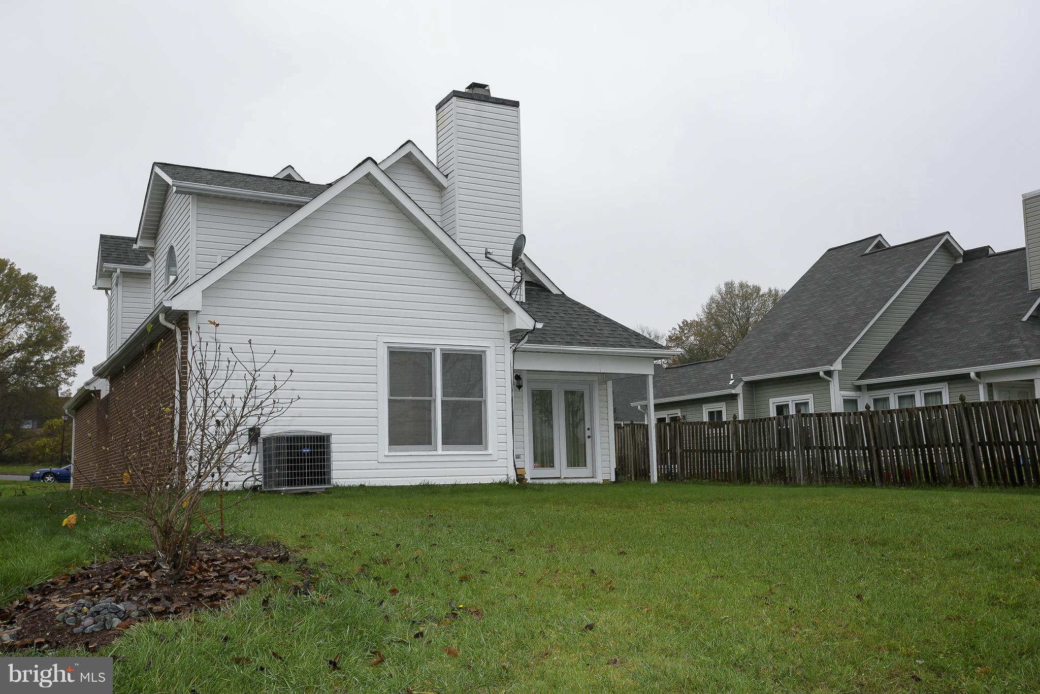 14243 Greenview Drive Laurel, MD 20708 - Photo 23 of 26 a view of a house with a backyard