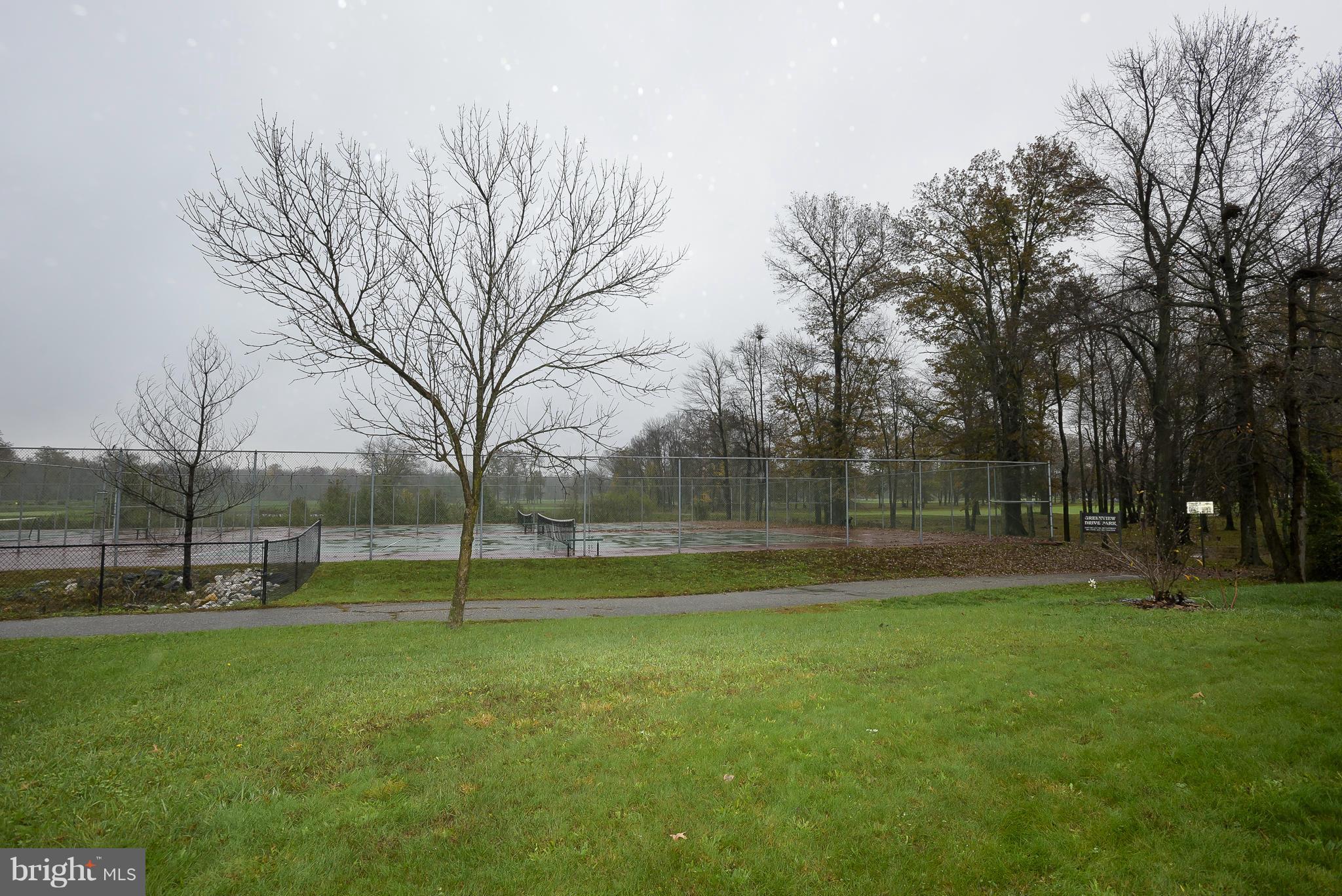 14243 Greenview Drive Laurel, MD 20708 - Photo 25 of 26 a backyard of apartments with trees
