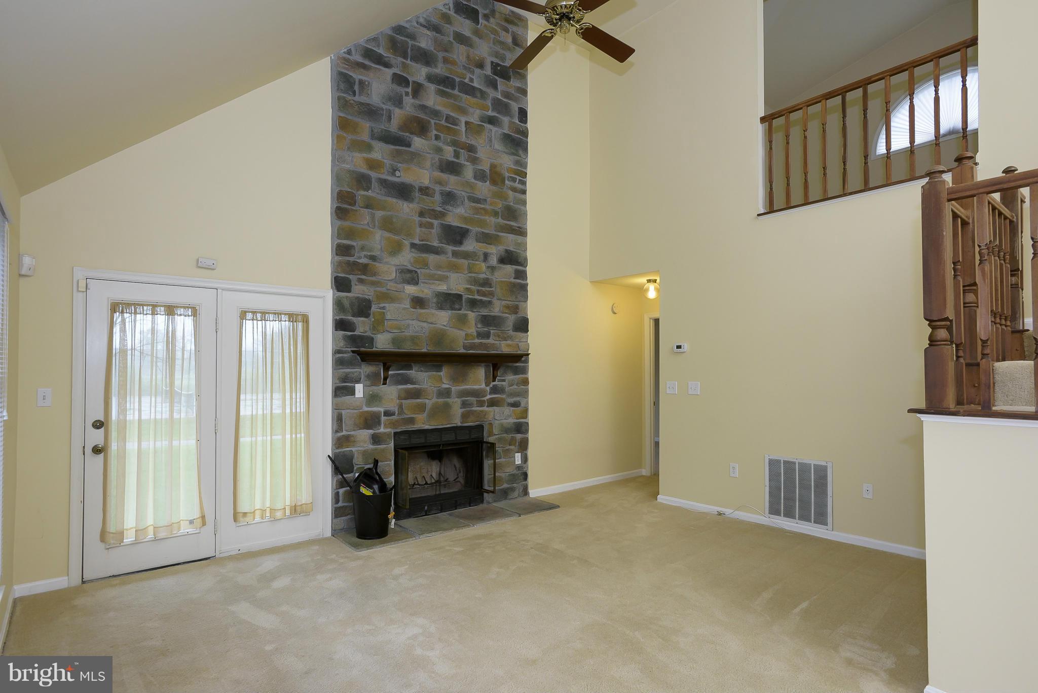 14243 Greenview Drive Laurel, MD 20708 - Photo 5 of 26 a view of an empty room with fireplace and a window