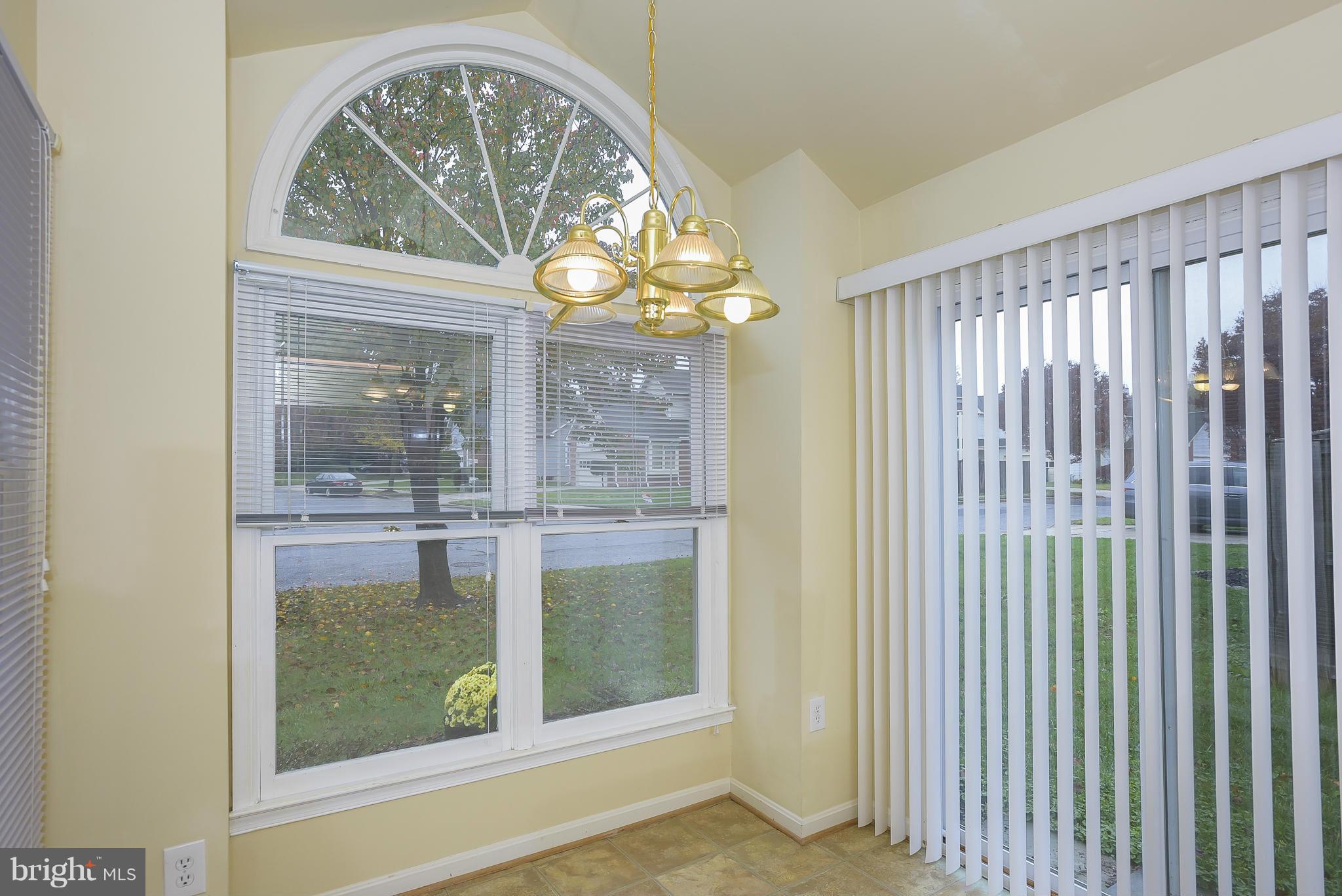 14243 Greenview Drive Laurel, MD 20708 - Photo 7 of 26 a view of a room that has a large window and front door