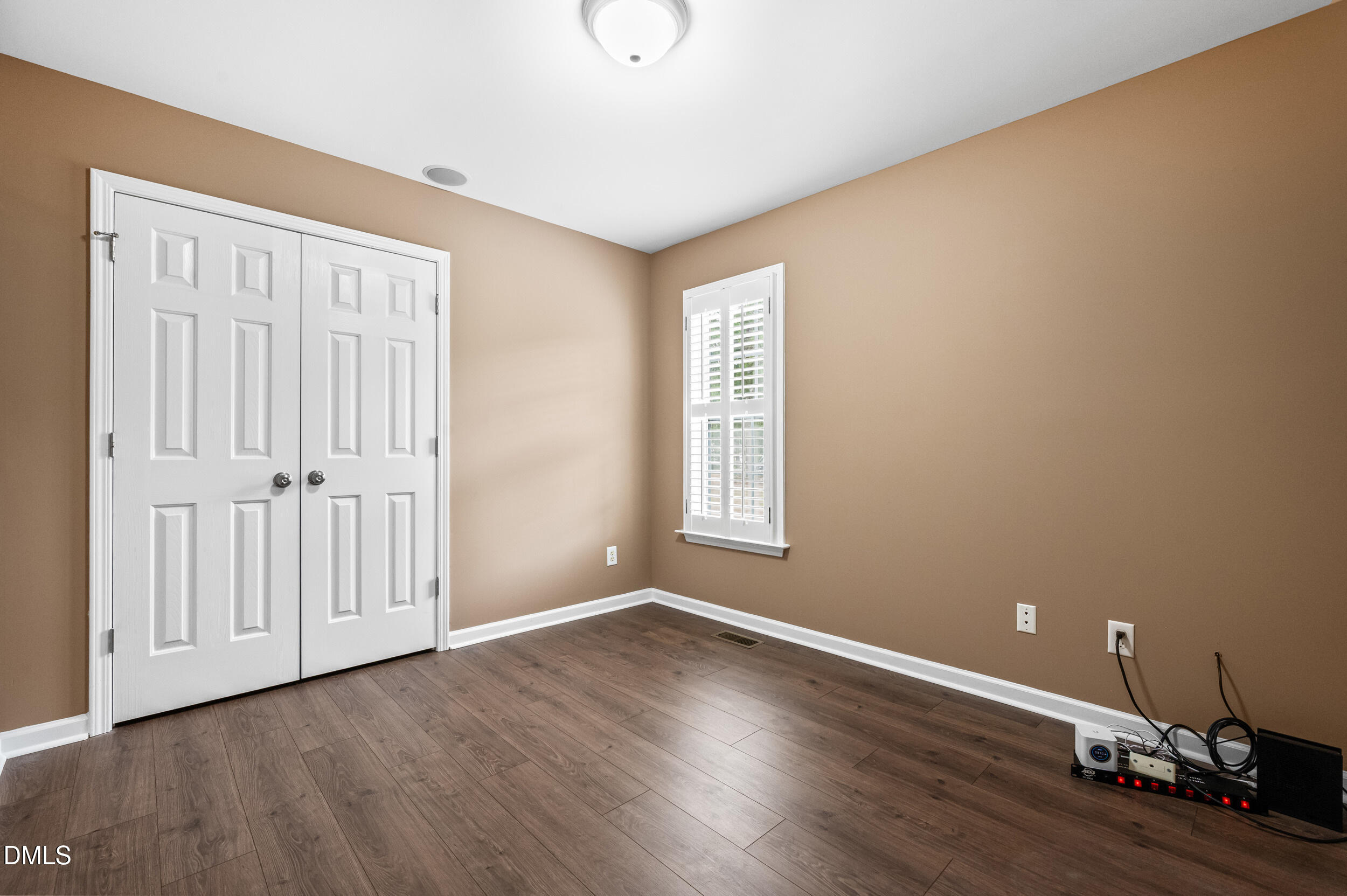 125 Rustic Lane Smithfield, NC 27577 - Photo 29 of 49 a view of an empty room with wooden floor