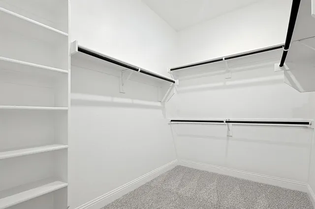 a view of an empty walk in closet