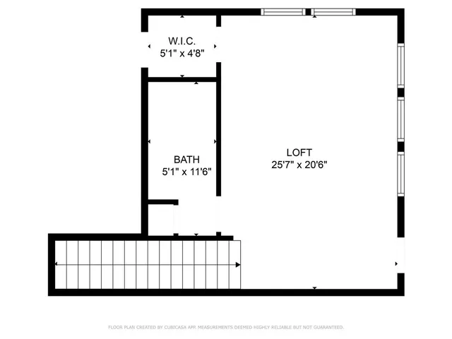 a black and white photo of a bench in a white wall