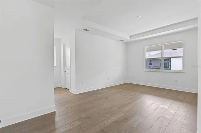 an empty room that has a window