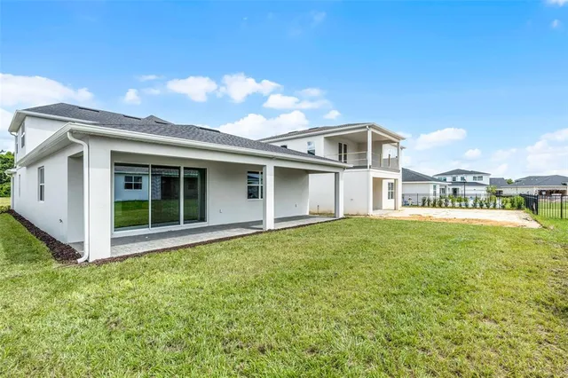a house that has a big yard in front of it