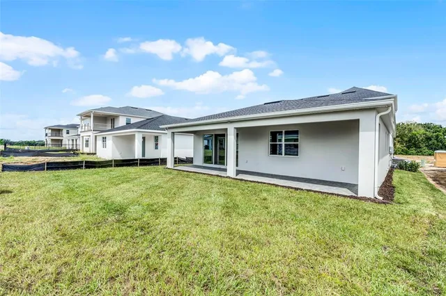 a view of a yard with a patio