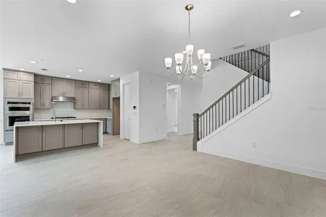 a view of a kitchen with electric appliances