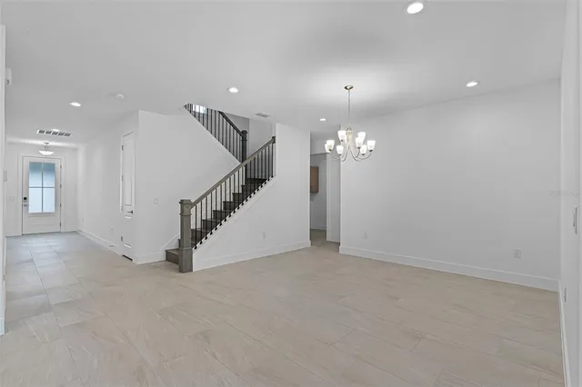 a view of an empty room with stairs