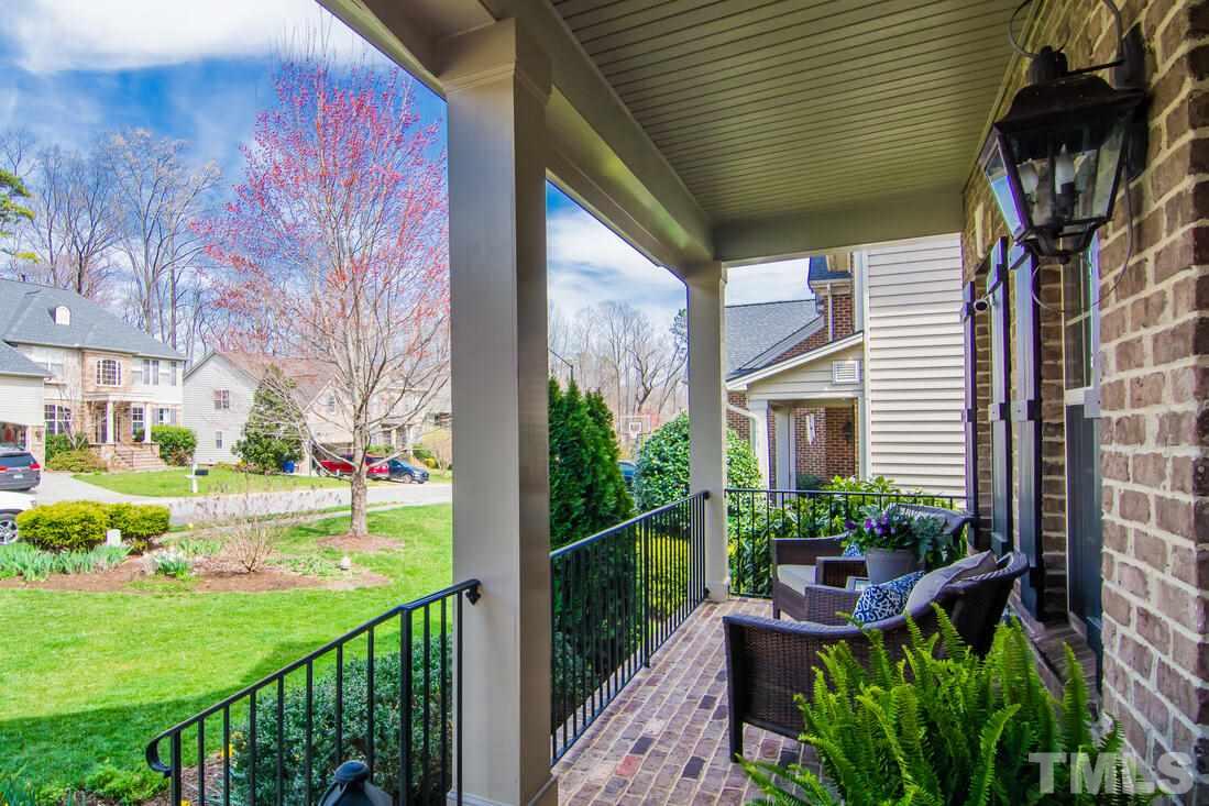 8214 Cushing Street Raleigh, NC 27613 - Photo 2 of 30 a view of a house with backyard and sitting area
