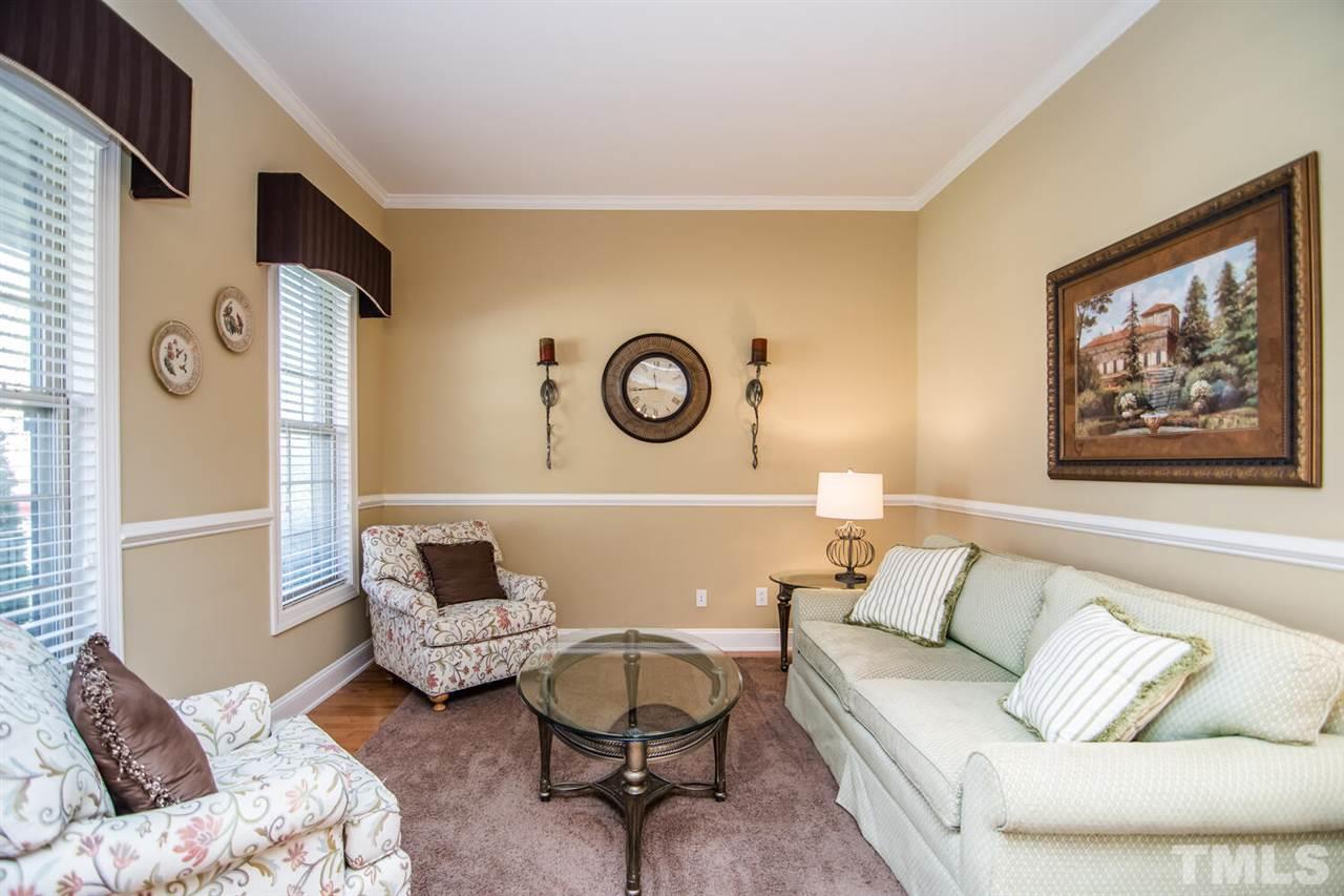 8214 Cushing Street Raleigh, NC 27613 - Photo 3 of 30 a living room with furniture and a large window
