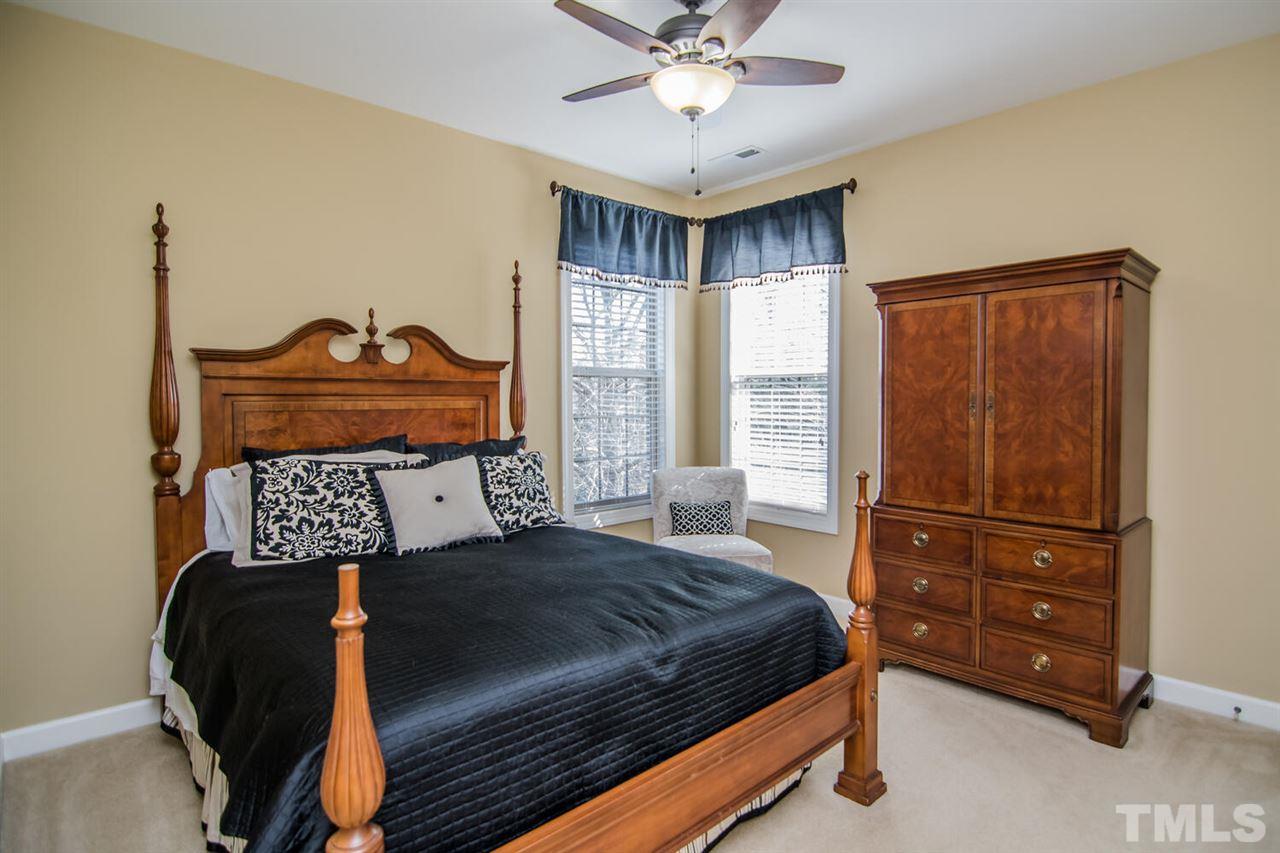 8214 Cushing Street Raleigh, NC 27613 - Photo 26 of 30 a bedroom with a bed and a window