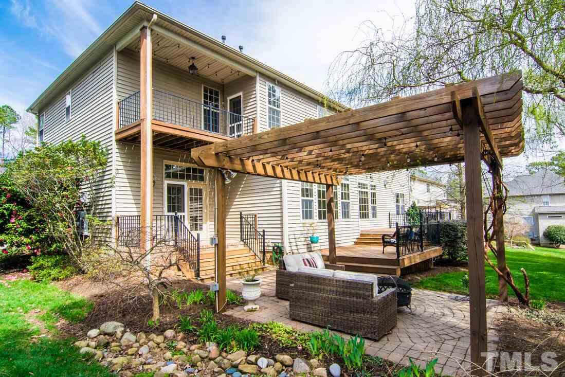 8214 Cushing Street Raleigh, NC 27613 - Photo 29 of 30 a backyard of a house with outdoor seating