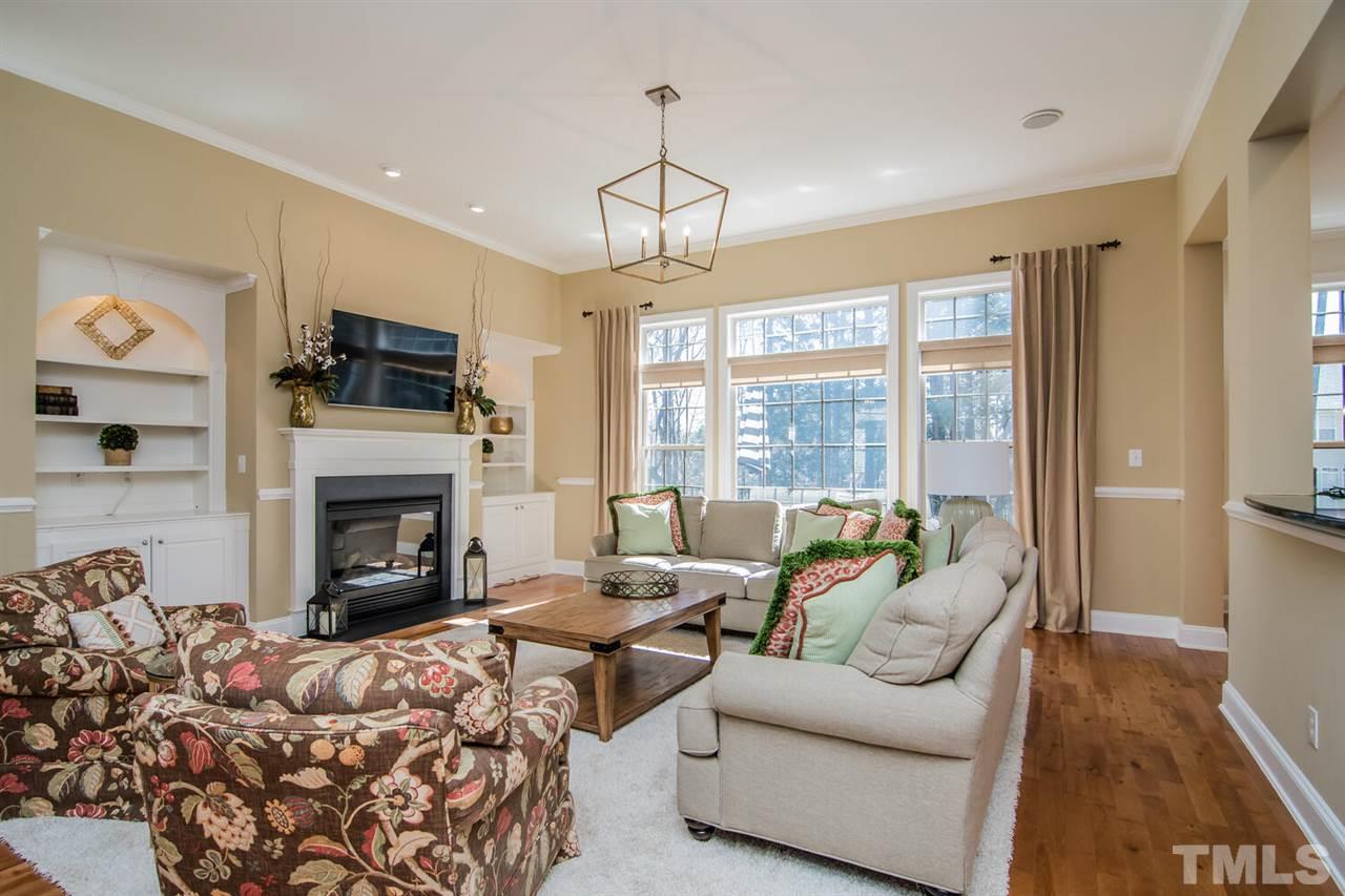 8214 Cushing Street Raleigh, NC 27613 - Photo 5 of 30 a living room with furniture fireplace and flat screen tv