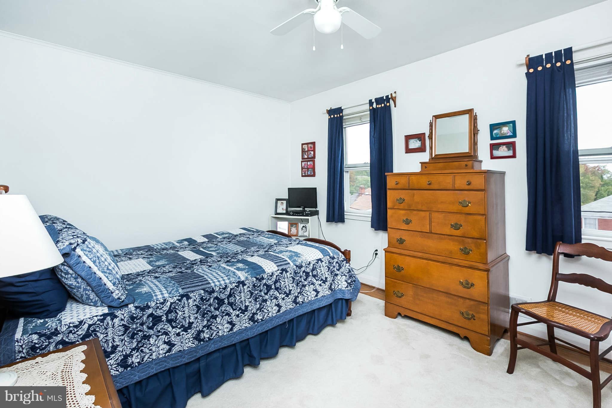 8315 Bon Air Road Baltimore, MD 21234 - Photo 14 of 25 a bedroom with a bed and furniture