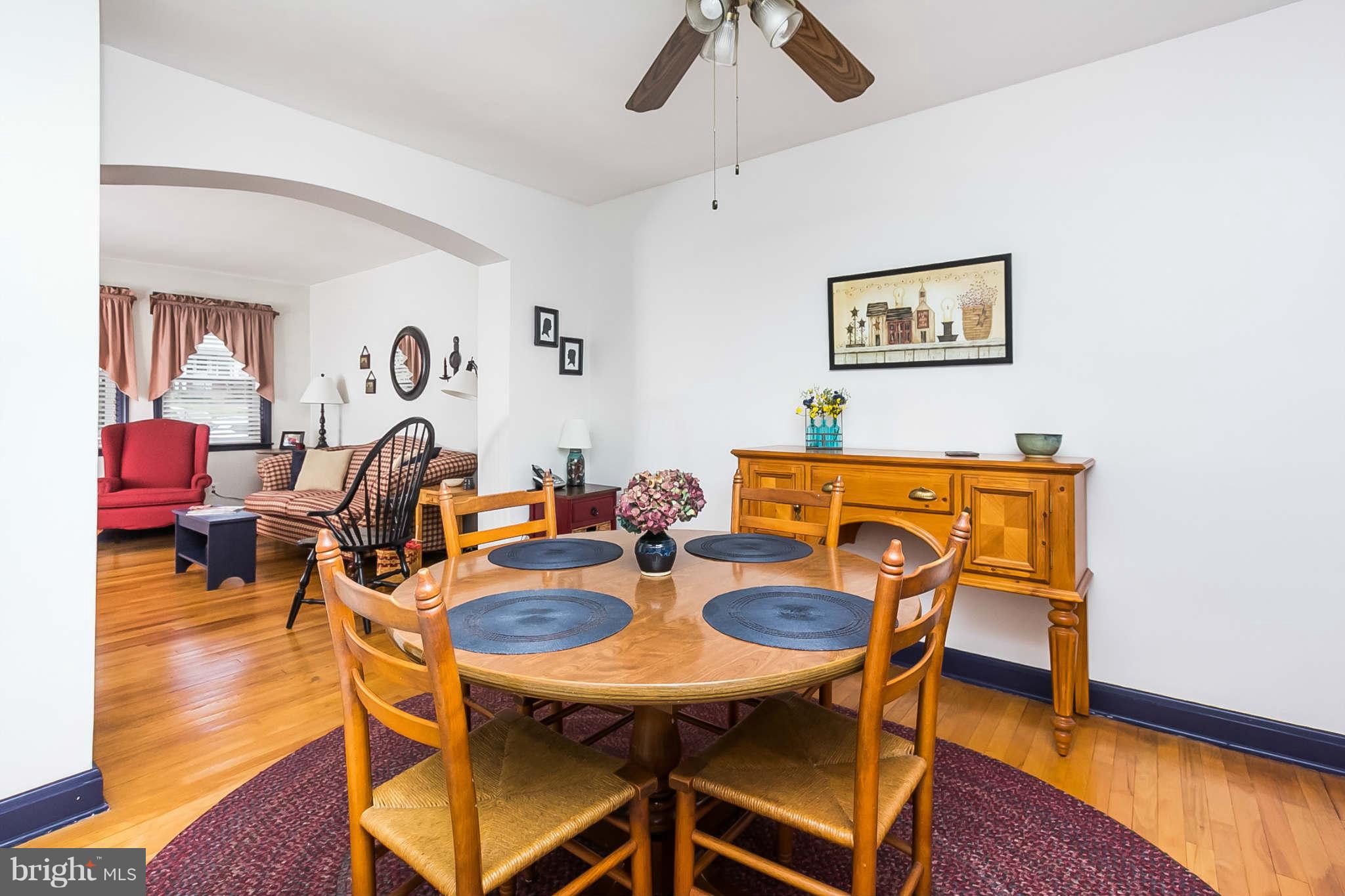 8315 Bon Air Road Baltimore, MD 21234 - Photo 8 of 25 a view of a dining room with furniture and wooden floor