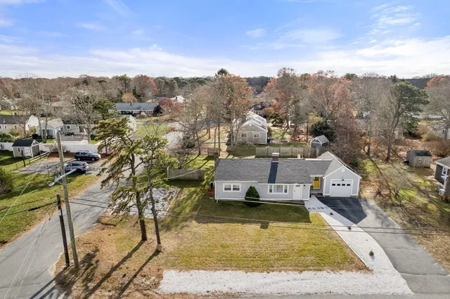 an aerial view of a house with a garden