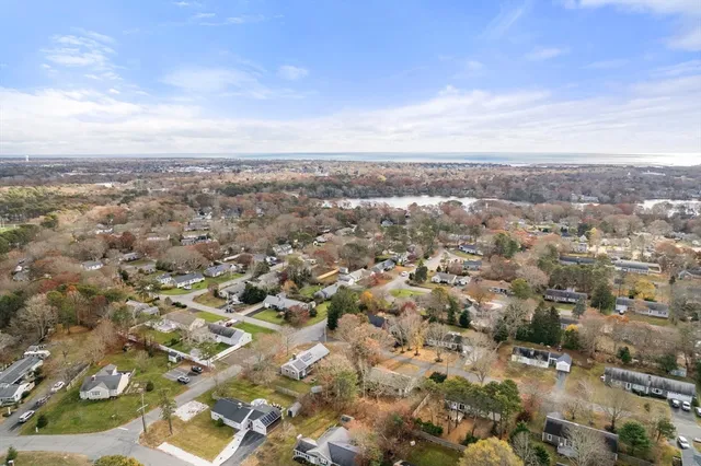 an aerial view of residential building and trees around