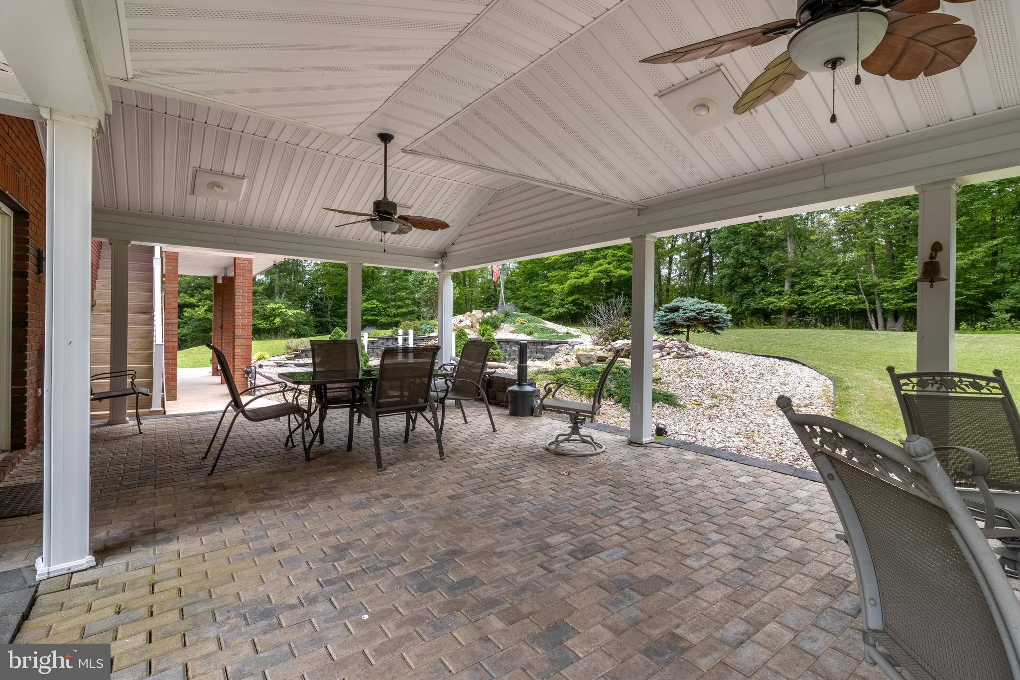 1296 Sunnyside Hollow Road Port Matilda, PA 16870 - Photo 13 of 49 a view of a patio with a table chairs and backyard