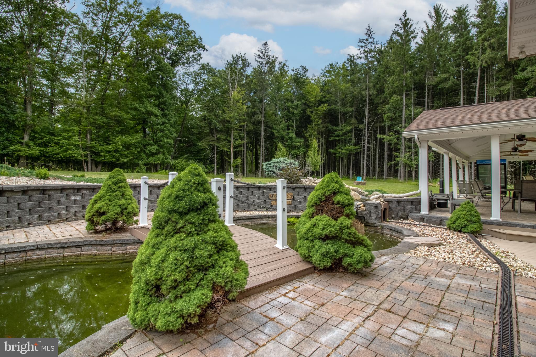 1296 Sunnyside Hollow Road Port Matilda, PA 16870 - Photo 16 of 49 a house with garden in front of it