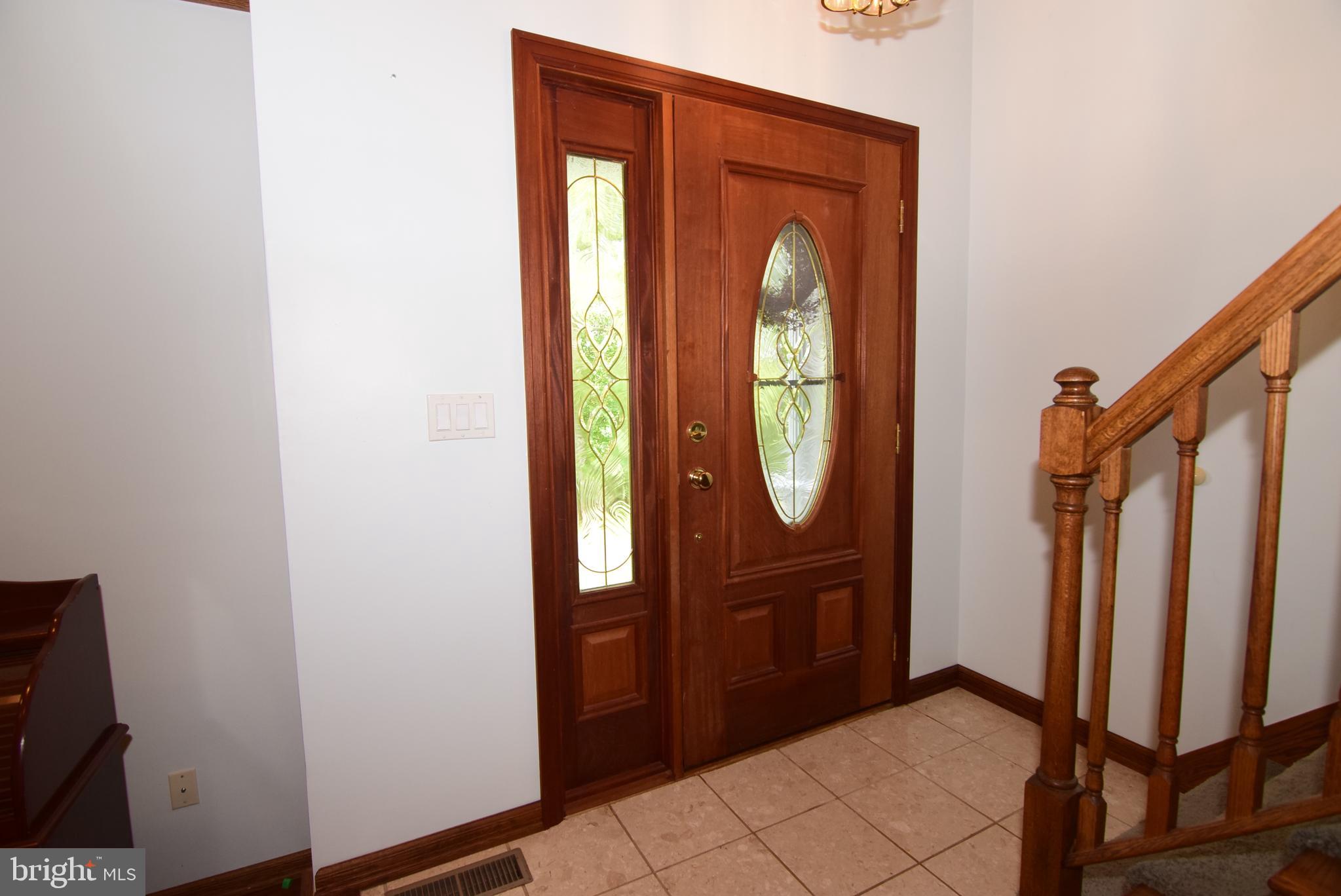1296 Sunnyside Hollow Road Port Matilda, PA 16870 - Photo 17 of 49 a view of a front door of a house