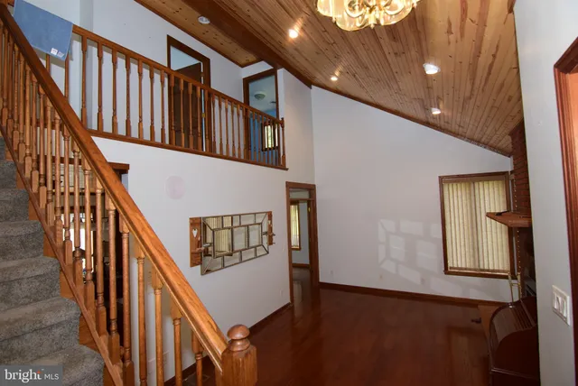 a living room with furniture fireplace and flat screen tv
