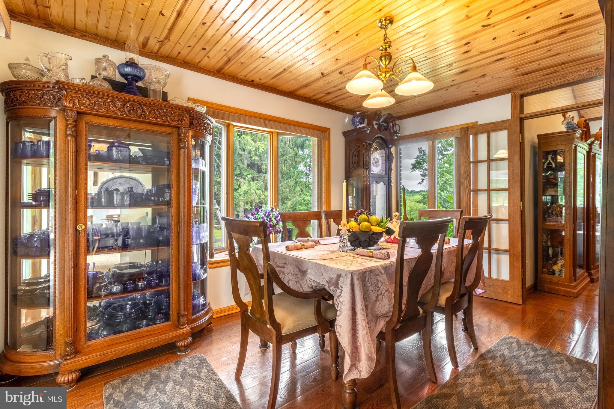 1296 Sunnyside Hollow Road Port Matilda, PA 16870 - Photo 23 of 49 a view of a dining room with furniture window and wooden floor