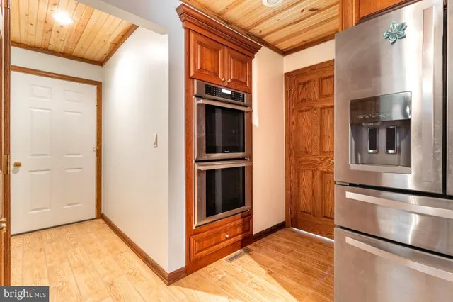a bathroom with a sink a mirror and a toilet