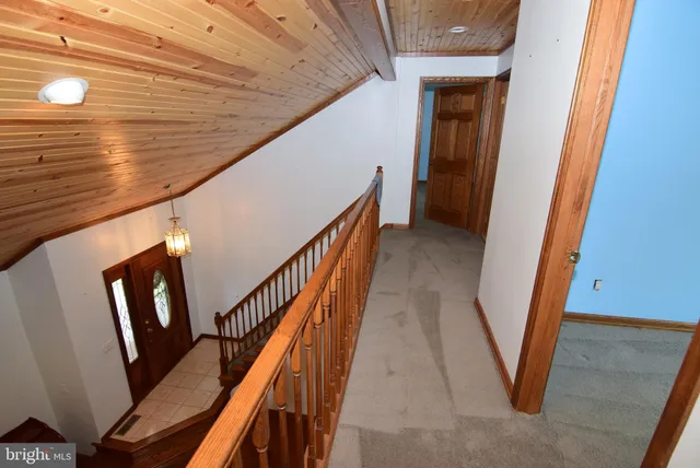 a view of a hallway with seating area