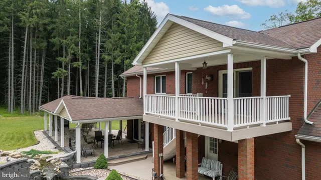 a view of a balcony with wooden floor