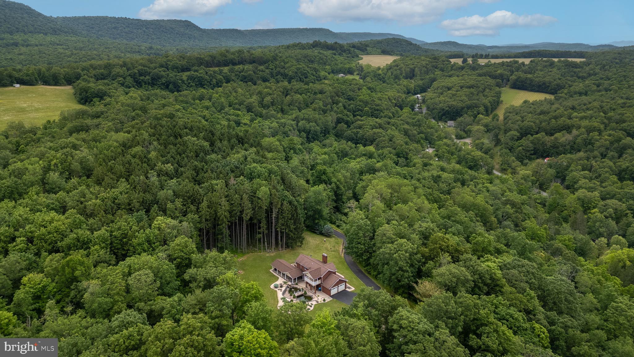 1296 Sunnyside Hollow Road Port Matilda, PA 16870 - Photo 49 of 49 an aerial view of residential house with outdoor space and trees all around