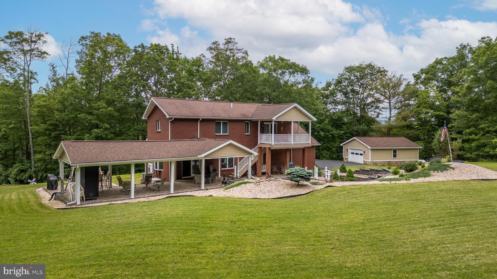 1296 Sunnyside Hollow Road Port Matilda, PA 16870 - Photo 6 of 49 a front view of a house with garden