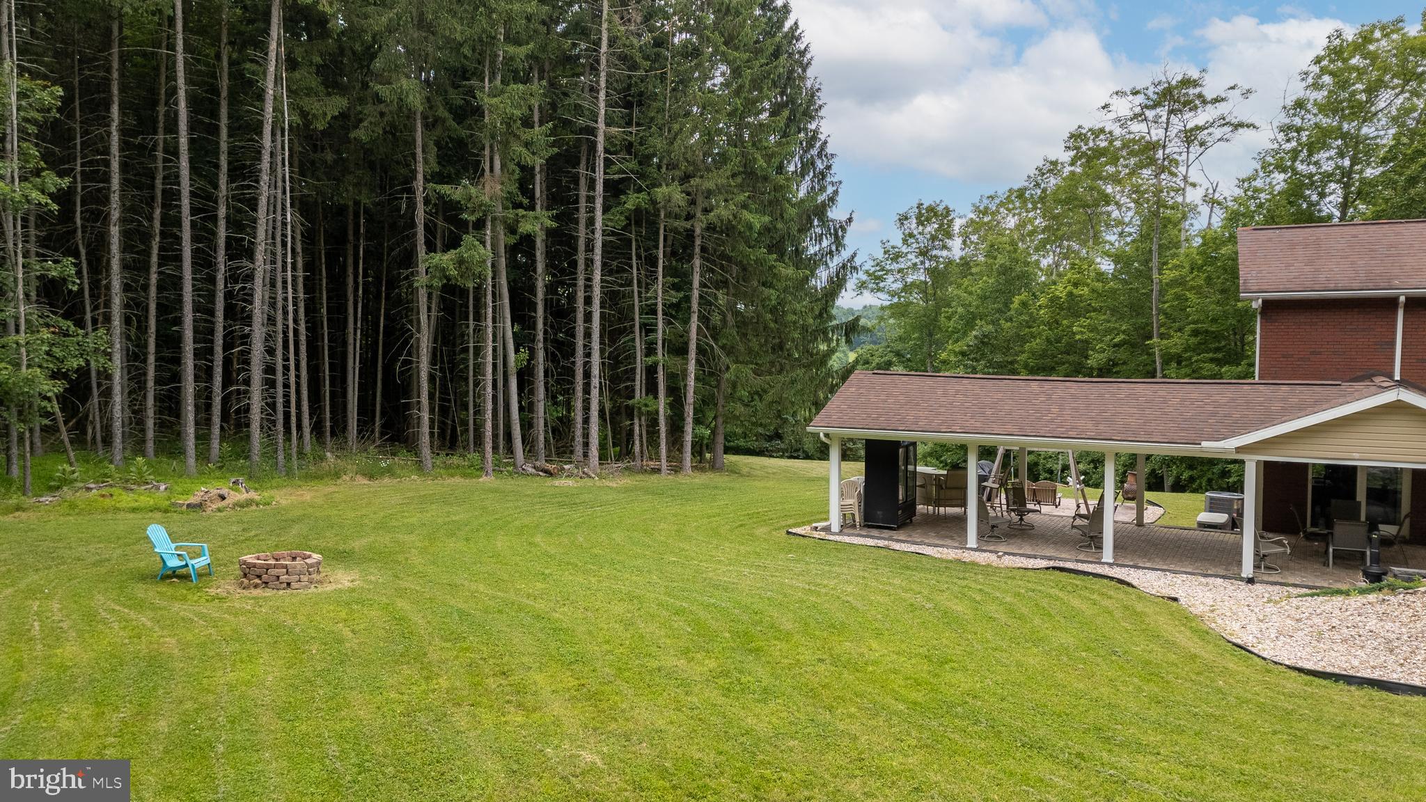 1296 Sunnyside Hollow Road Port Matilda, PA 16870 - Photo 8 of 49 a view of a house with a backyard
