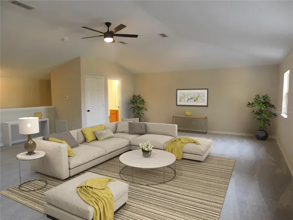 a living room with furniture and a table