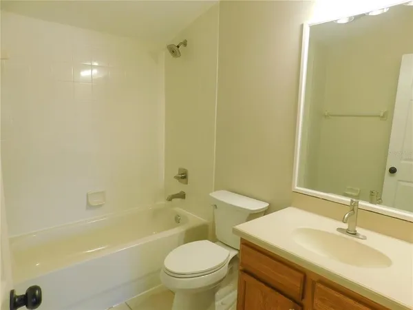 a bathroom with a sink a toilet and a bathtub