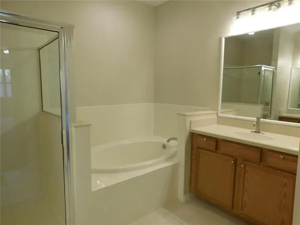 a bathroom with a bathtub and a sink