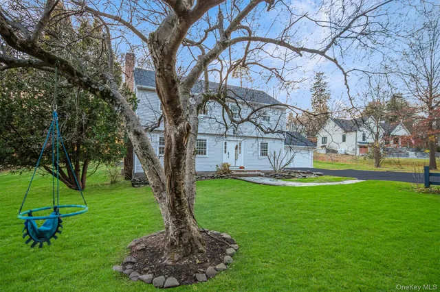 a view of a chairs in front of the house
