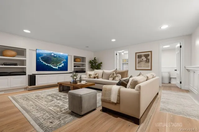 a bedroom with a bed and a potted plant