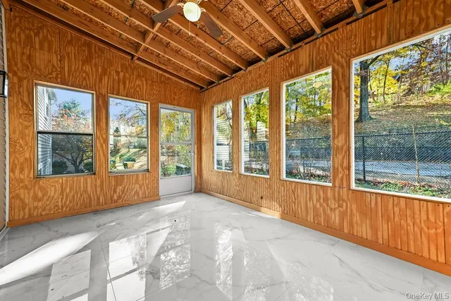 a kitchen with white cabinets sink and stainless steel appliances