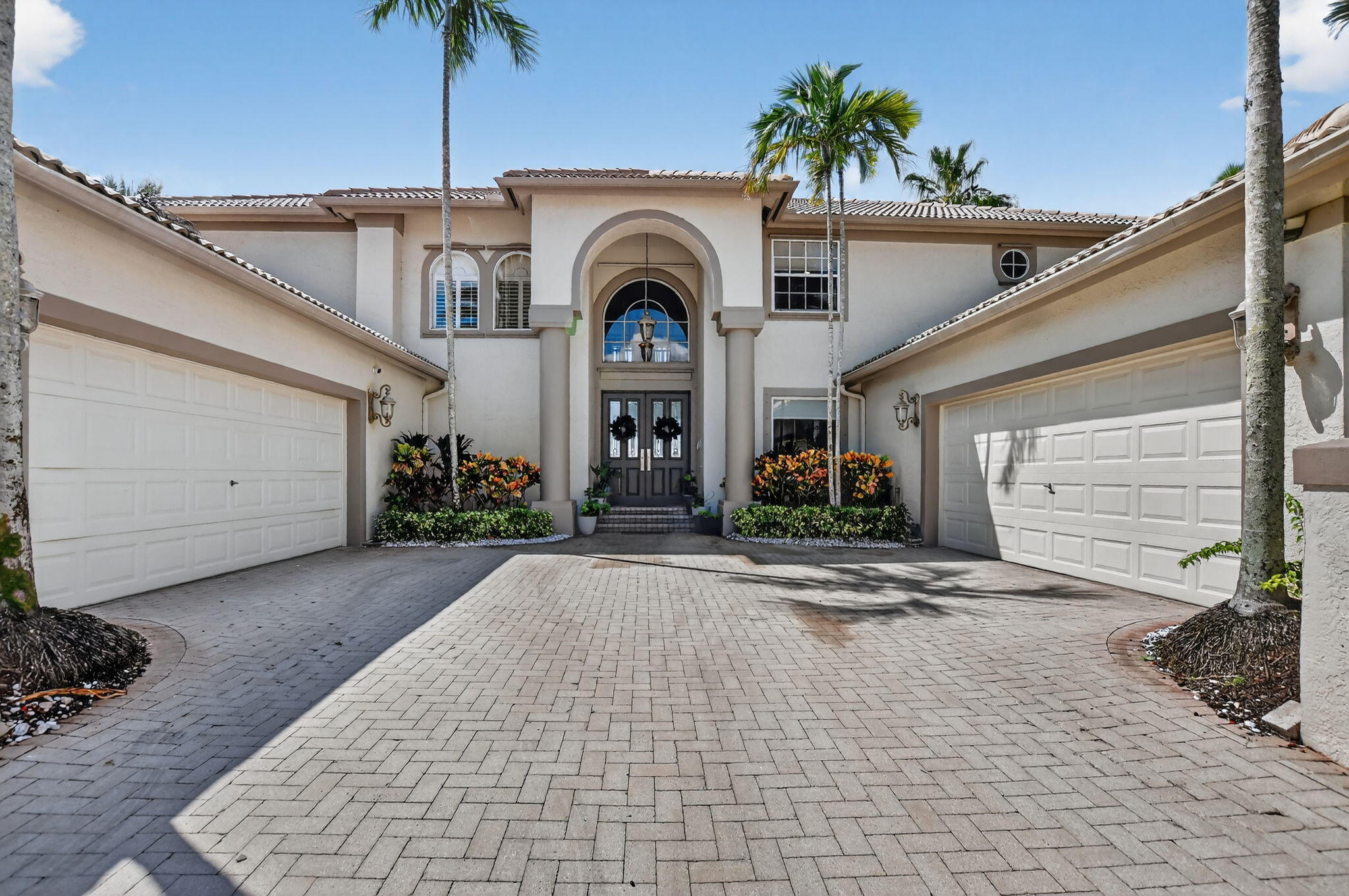 21383 Falls Ridge Way Boca Raton, FL 33428 - Photo 2 of 44 a front view of a house with a yard and garage
