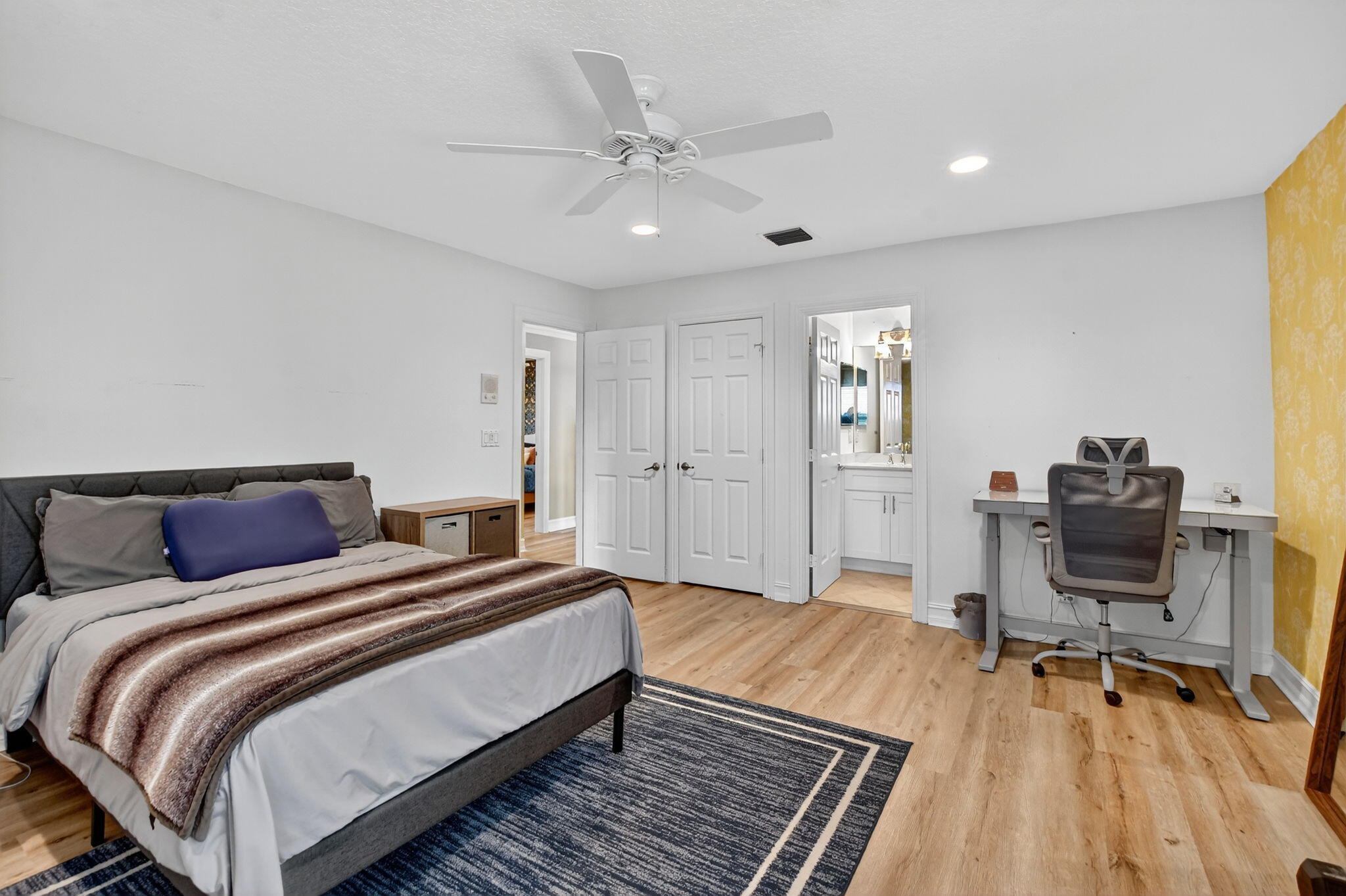 21383 Falls Ridge Way Boca Raton, FL 33428 - Photo 25 of 44 a spacious bedroom with a bed and a table