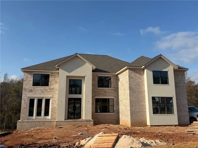 a front view of a house with a yard